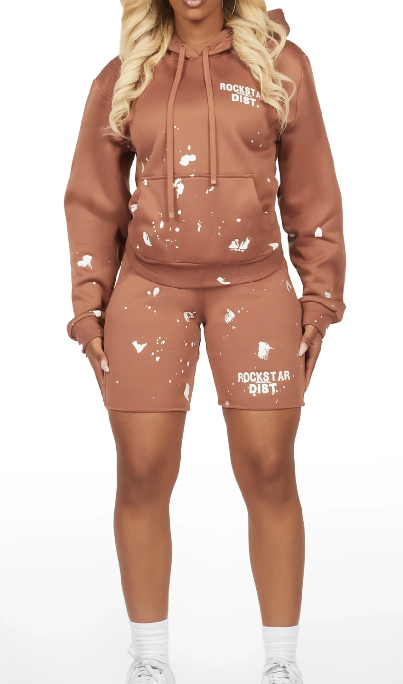 two-piece matching set features a cozy pullover hoodie and fitted biker shorts